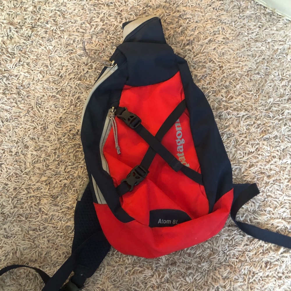 Red and blue Patagonia 8L backpack